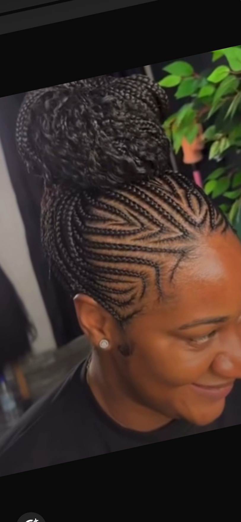 Designed cornrows into a curly bun